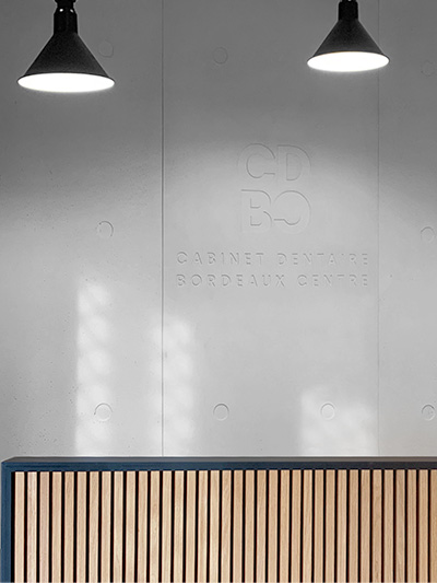 Logo for CDBC in concrete wall - front